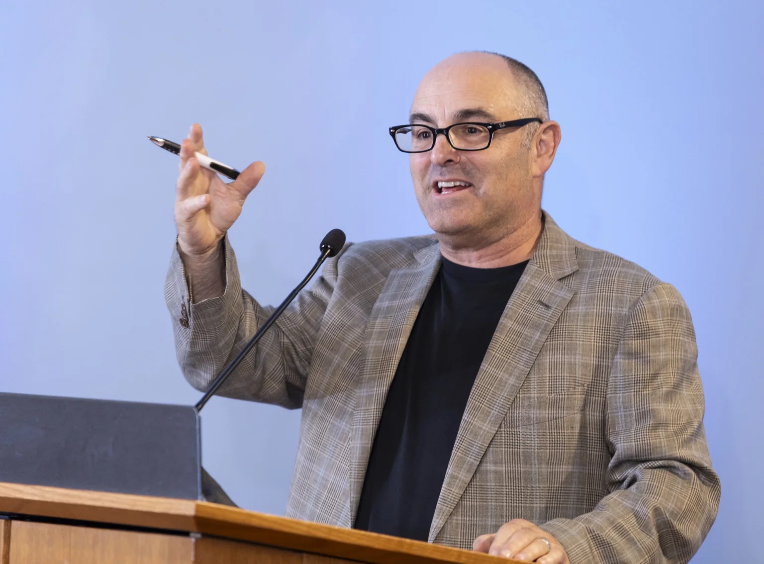 Phil Zuckerman speaking at a podium